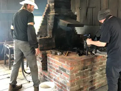 Blacksmith in his shop