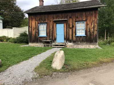 log building with a blue door