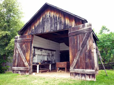 small wooden structure with doors open